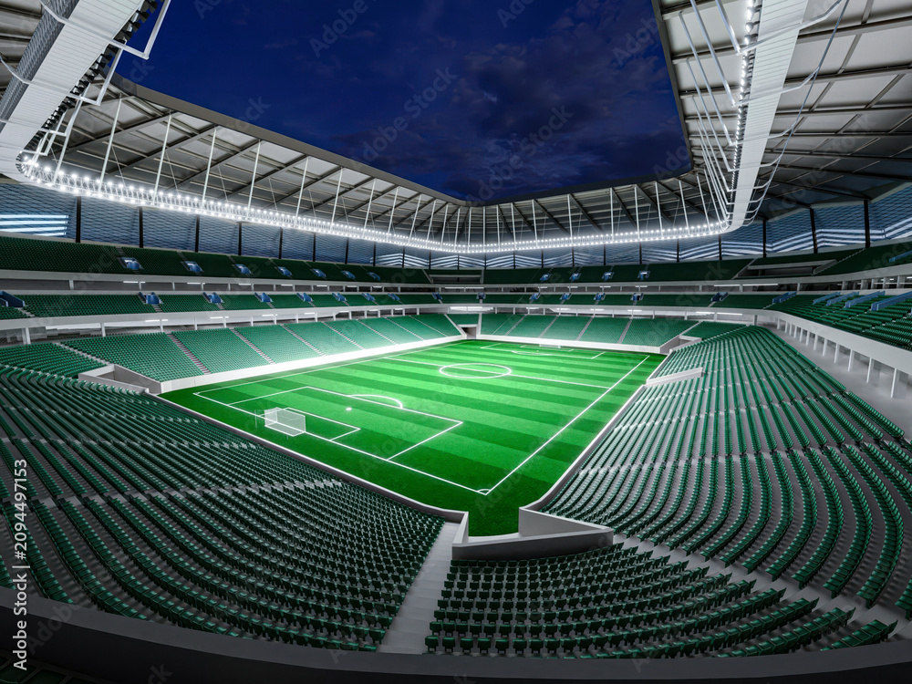 Fototapeta premium Illuminated football stadium at night with vibrant green pitch, modern seating, and dramatic architectural lighting creating a premium sports venue atmosphere.