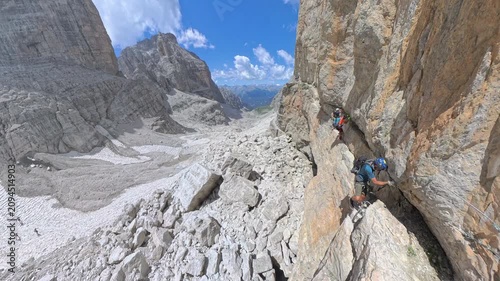 Climbers starting the Via Ferrata Bocchette Centrali at Bocca di Brenta, Brenta Dolomites, Italy