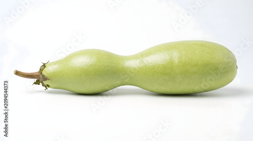 Fresh, Elongated Light Green Bottle Gourd, an Organic and Healthy Vegetable with a Distinctive Double-Bulb Shape, Often Used in Various Cuisines, Presented on a Clean White Background