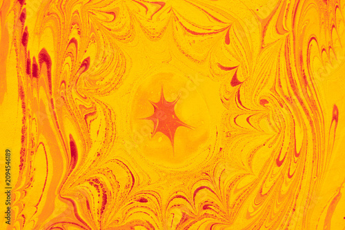 Ebru Abstract Swirling Patterns in Bright Yellow and Orange Hues with Intricate Red Highlights Creating a Dynamic Visual Composition