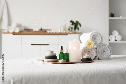 Spa treatment room with lit...