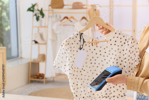 Woman holding a polka dot d...