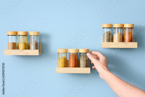 Hand reaching for a spice j...