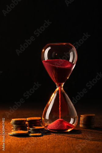 Red sand hourglass with fal...