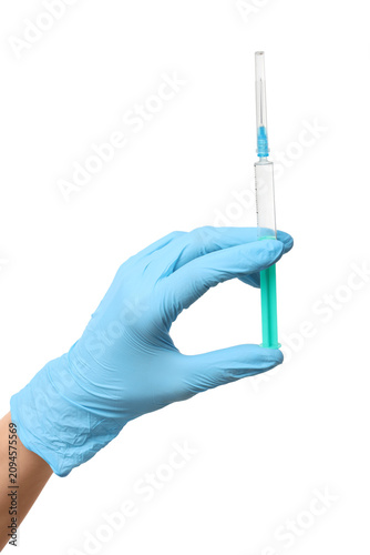 Hand in blue medical glove ...