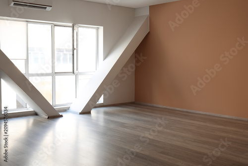 Empty modern room with larg...