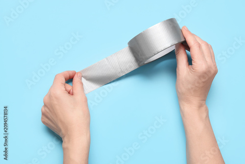 Hands holding and unrolling...