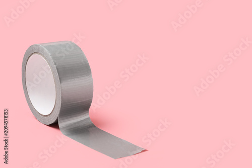 Roll of gray duct tape with...