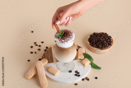 Female hand with glass of t...