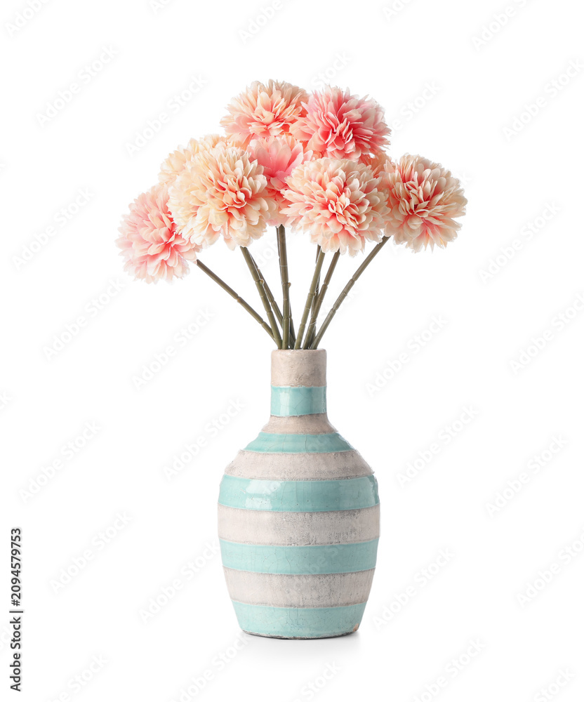 Obraz premium Striped vase of beautiful artificial pink chrysanthemum flowers isolated on white background