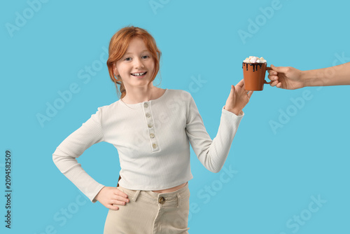 Teenage redhead girl taking...