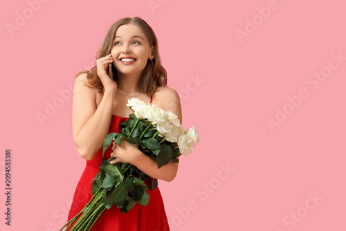 Happy young woman with bouq...