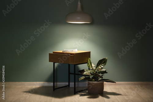 Wooden bedside table with m...