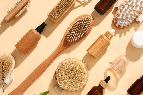 Foto Set of cosmetic products for anti-cellulite massage on beige background