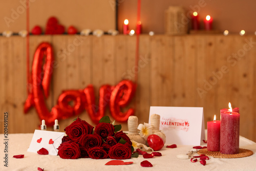 Flowers with burning candle...