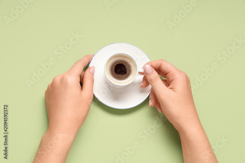 Female hands with cup of co...