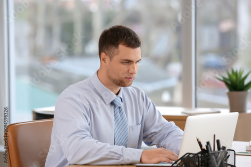 Young businessman working w...