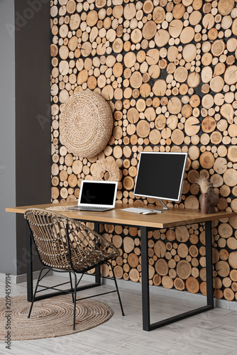 Stylish workplace with mode...