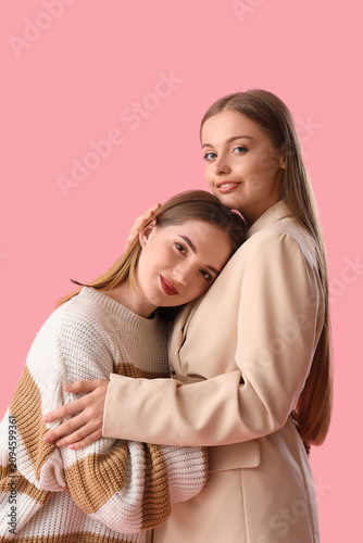 Young lesbian couple huggin...