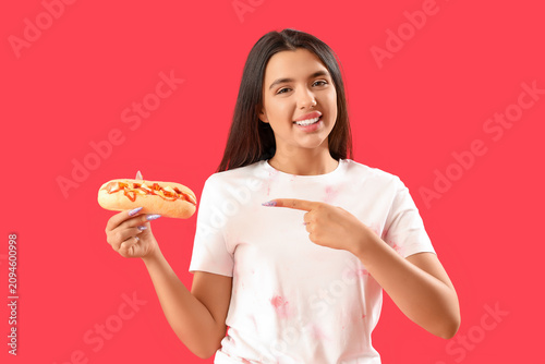 Pretty young woman pointing...