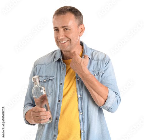Mature man with bottle of v...