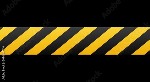 Yellow and black hazard warning stripe tape isolated on black background