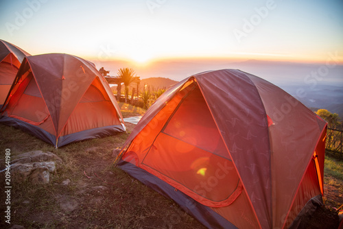 Quadro em tela Tent camp in nature background with sunrise on top of mountain