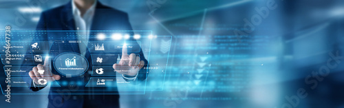 Fotografía Financial analyst reviewing markets using hands evaluating core Financial Analytics metrics upon a glowing virtual screen projecting market growth