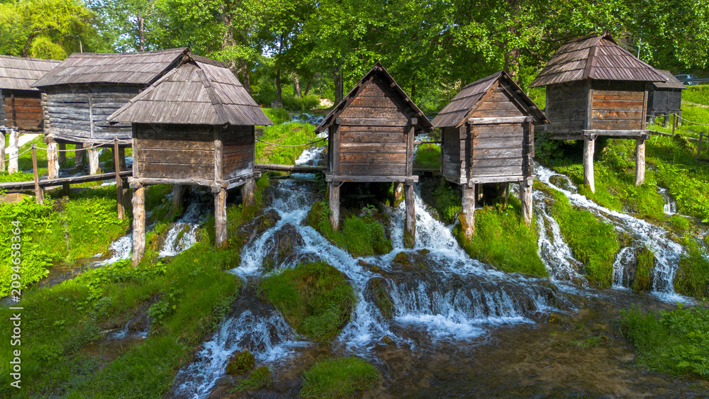 Obraz premium Aerial View of Historic Pliva Wooden Watermills on Waterfalls in Jajce Bosnia and Herzegovina