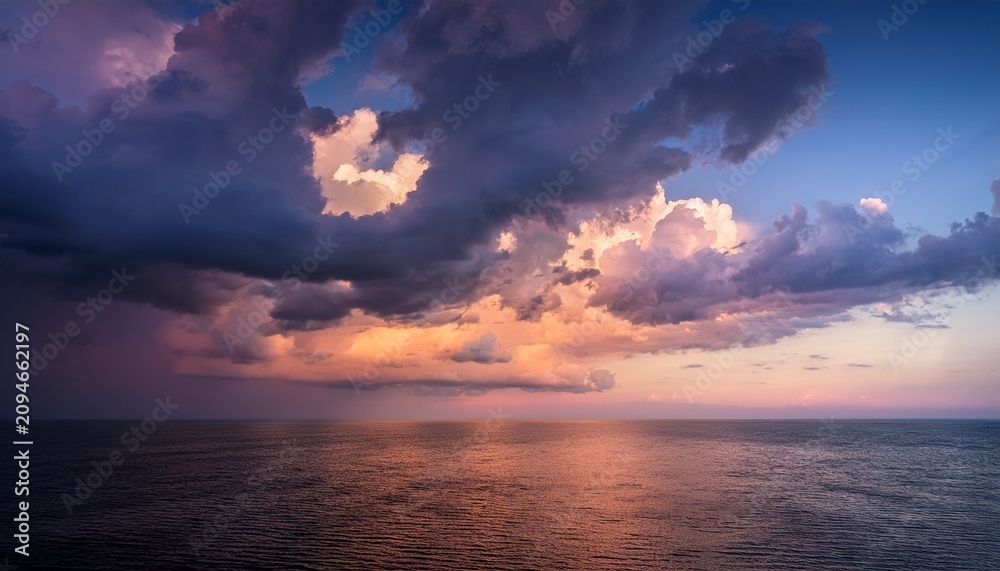 Fototapeta premium dramatic clouds with soft hues during twilight creating a serene atmosphere