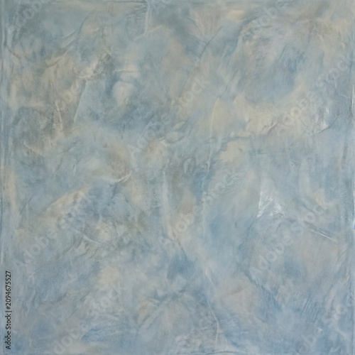 Polished venetian plaster texture background in a serene dusty blue tone