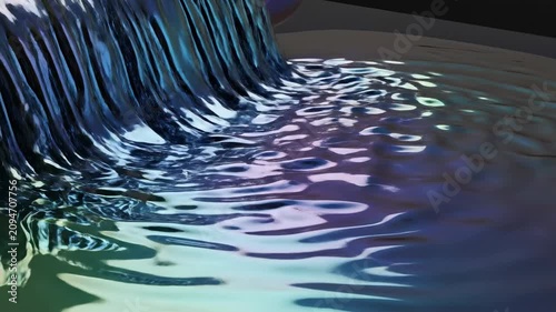 Fluid motion of colorful liquid spreading on a flat surface in a studio setting