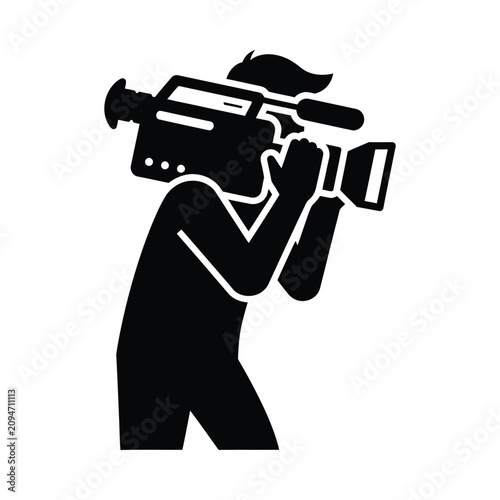 Filmmaker silhouette holding professional video camera during outdoor production against bright sky