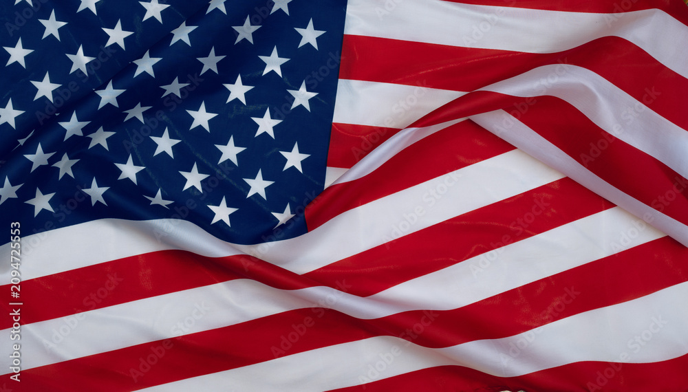 Obraz premium Waving American flag close up with fabric folds and texture, clean patriotic background for USA themes, national identity and celebration.