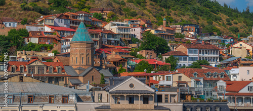 Old Tbilisi city panorama with Surb Gevorg church and traditional houses in Georgia