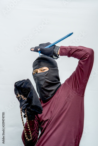 Картината върху платно Thief wearing balaclava holding a weapon