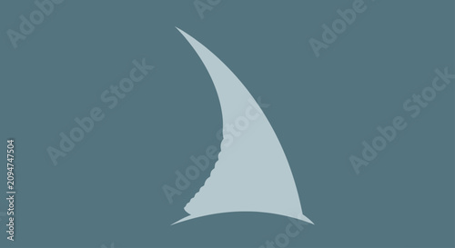 Fotografie Minimalist shark fin silhouette on grey background.