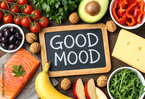 Fresh and healthy assortment of good mood foods arranged around a chalkboard sign