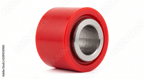 Macro of a heavy-duty control arm bushing. Red polyurethane cylinder enclosing a thick steel inner sleeve. Off-road suspension hardware.