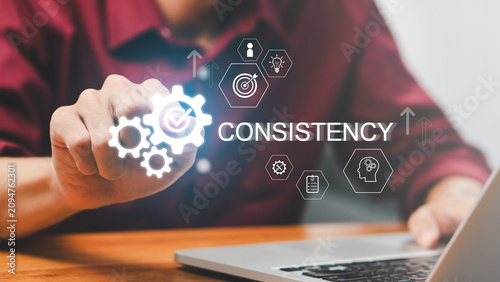 Business professional improving process consistency, operational excellence and workflow optimization with digital quality management interface for performance, compliance and continuous improvement.