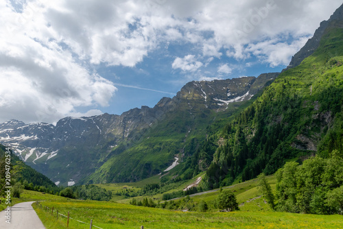Photos Green alpine valley with lingering snow near Mittersill
