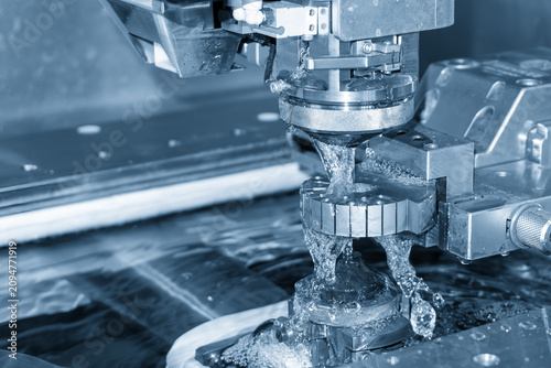 Canvastavla vHigh-precision wire EDM machine cutting process on a metal mold part in a blue tone scene