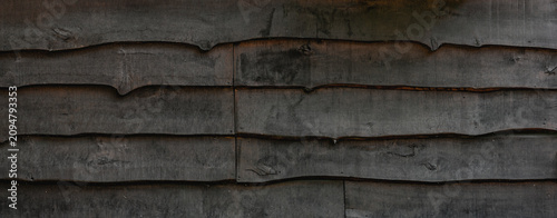 фотографія Dark Gray Unedged Pine Board Texture