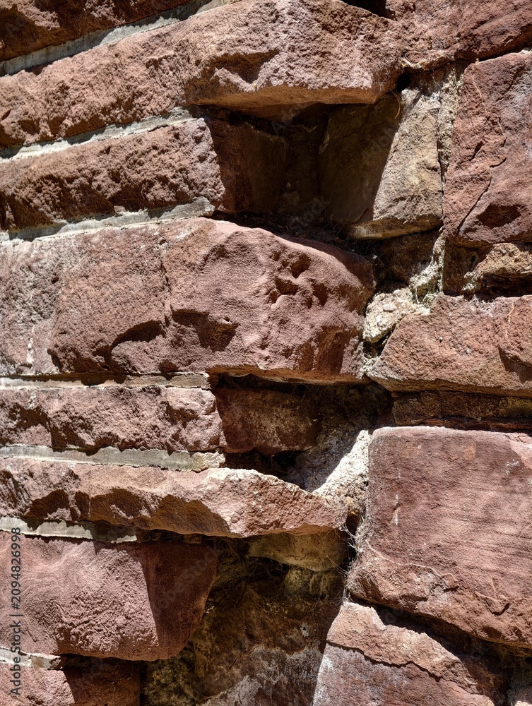 Fototapeta premium Germany 2026 ancient stone wall with mortar close-up in outdoor setting periodic