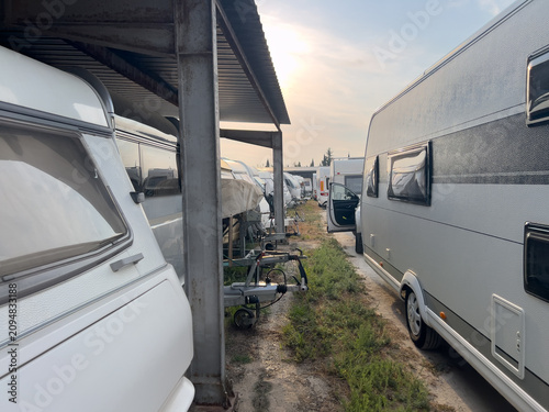 Fotografie Caravans and recreational vehicles parked in storage lot
