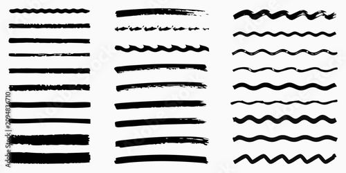 Fotografía thick black ink brush strokes and calligraphy swirls on white background handwri