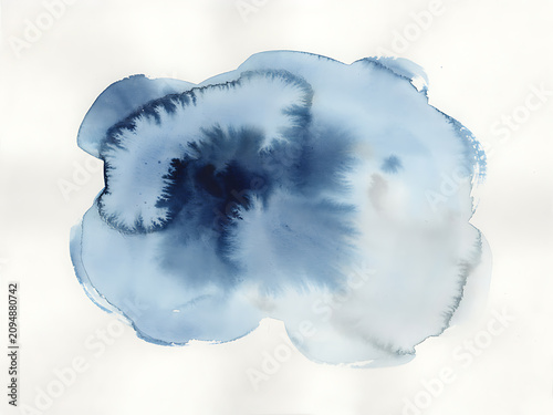 Single organic watercolor ink blot in shades of deep indigo and teal blue isolated on a plain white paper background surface