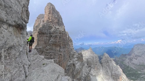 Two hikers approaching Bocca degli Armi on Via Ferrata Bocchette Centrali, Brenta Dolomites