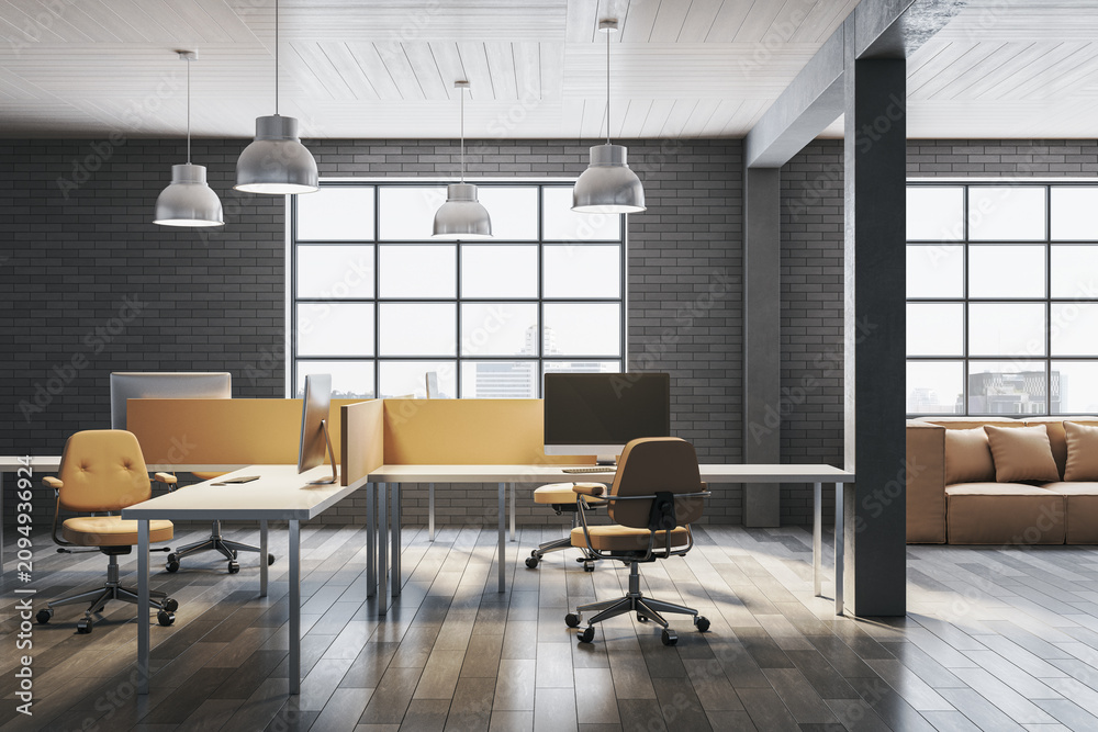 Obraz premium Stylish loft coworking office with dark brick walls, yellow chairs, white desks with computers, pendant lamps, sofa and city view windows. 3D Rendering
