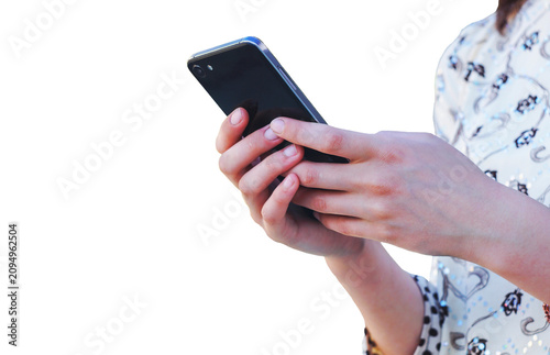 Person typing on a mobile phone screen against a white background.